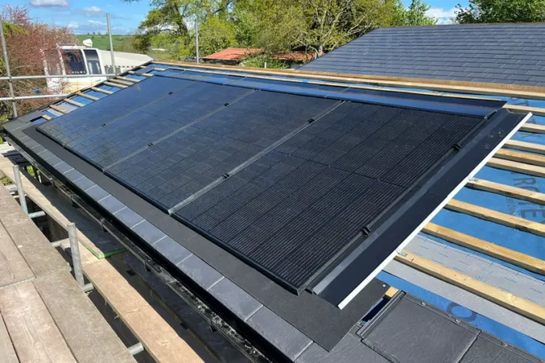 in roof pv panels being installed on a house